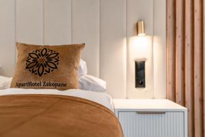 Posteľ alebo postele v izbe v ubytovaní Aparthotel Zakopane