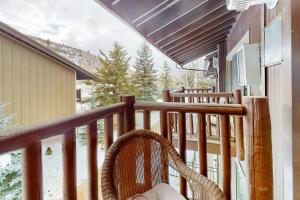 a wicker chair sitting on a balcony with a view at Sidewinder Sunshine in Park City