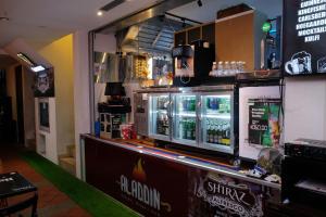 a bar with a drink counter in a restaurant at Sandpiper Hotel Single Room, Long Stay and Short Hours in Singapore