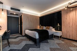 Posteľ alebo postele v izbe v ubytovaní Aparthotel Zakopane
