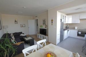 a living room with a couch and a table at SuperB apartment with incredible view at the best location in Veszprém