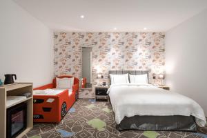Postel nebo postele na pokoji v ubytování Phoenix Hotel Taichung
