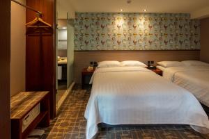 Katil atau katil-katil dalam bilik di Rich & Free Hotel - Kaifeng 富逸旅趣-北車開封館