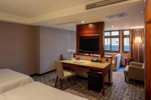 Katil atau katil-katil dalam bilik di Rich & Free Hotel - Kaifeng 富逸旅趣-北車開封館