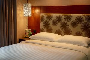 Katil atau katil-katil dalam bilik di Rich & Free Hotel - Kaifeng 富逸旅趣-北車開封館