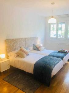 A bed or beds in a room at Avenida Apartamento