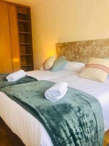 A bed or beds in a room at Avenida Apartamento