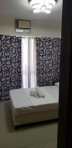 Ένα ή περισσότερα κρεβάτια σε δωμάτιο στο Sm uptown 1 bedroom condo primamera residence cagayan de oro city