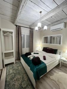 a bedroom with a large bed in a room at Smaragd in Doba +134 photos