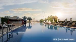 a rendering of a swimming pool at a resort at LUX - The JBR Dubai Eye Suite in Dubai