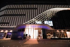 a building with lights on the side of it at Cres Asia Residence in Chengdu