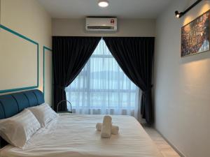 Splendours Condos@Jesselton Quay房間的床