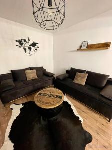 a living room with a couch and a table at Apartmán MATEO Donovaly in Donovaly +19 photos