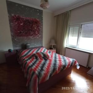 Postel nebo postele na pokoji v ubytování Kolhida home