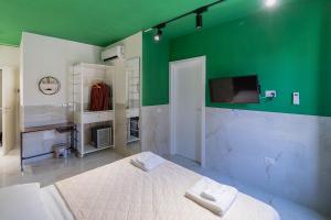 Posteľ alebo postele v izbe v ubytovaní Medina H. Napoli Centro, by ClaPa Group