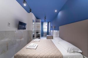 Posteľ alebo postele v izbe v ubytovaní Medina H. Napoli Centro, by ClaPa Group