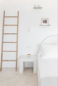 Rúm í herbergi á Villa Maestro Mykonos