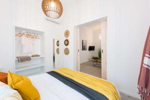 Łóżko lub łóżka w pokoju w obiekcie Modita Boutique Apartments