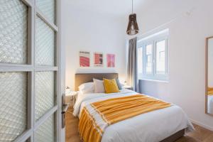 Łóżko lub łóżka w pokoju w obiekcie Modita Boutique Apartments