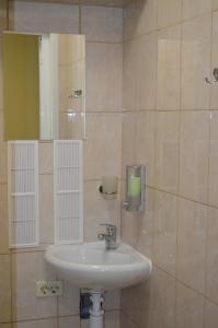 a bathroom with a sink and a mirror at Stars Hostel in Yaroslavl
