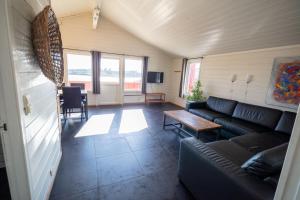 a living room with a couch and a table at Kristiansand Feriesenter in Kristiansand