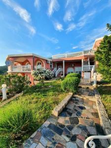 a large house with a walkway in front of it at Villa Lilly 2 in Cesarica