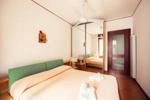 A bed or beds in a room at A due passi dal mare by Wonderful Italy