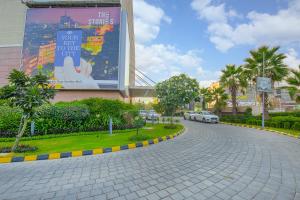 a cobblestone street in front of a building at The Stories Hotel in Ludhiana