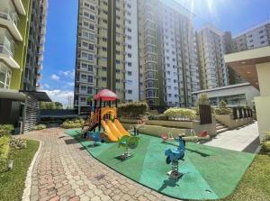 a playground in front of a apartment building at Mesaverte Deluxe Studio with Balcony in Cagayan de Oro