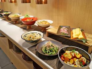 a buffet with many different types of food on it at CHISUN PREMIUM Kyoto Kujo in Kyoto