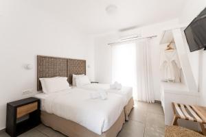 Ein Bett oder Betten in einem Zimmer der Unterkunft Super Paradise Hotel