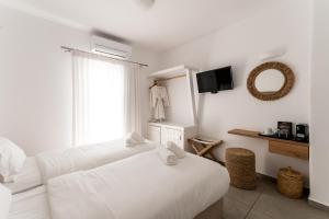 Ein Bett oder Betten in einem Zimmer der Unterkunft Super Paradise Hotel