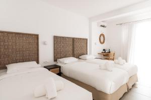 Ein Bett oder Betten in einem Zimmer der Unterkunft Super Paradise Hotel