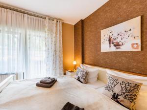 a bedroom with a large bed and a window at Zimmer Nr 4 im Haus Sabine in Braunlage