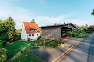 an aerial view of a house and a barn at Villa Luna Braunlage in Braunlage