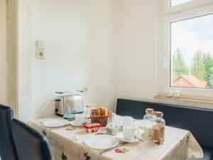 a table with a coffee maker on top of it at Ferienwohnung Rorik - Schierke in Schierke