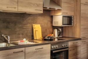 a kitchen with a sink and a microwave at Reitstieg in Braunlage