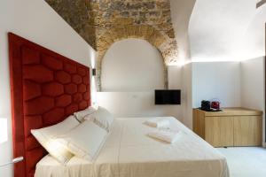 Bastione Spasimo Boutique Hotel客房内的一张或多张床位