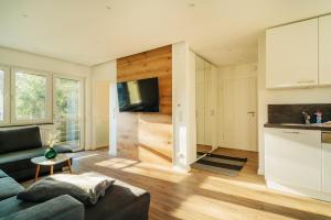 a living room with a couch and a kitchen at Fichte in Braunlage