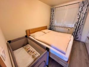 Posteľ alebo postele v izbe v ubytovaní Apartmány Friends Tatry