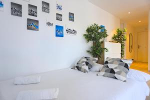 Postel nebo postele na pokoji v ubytování OASIS Malaga City Apartment + 22 fotografií