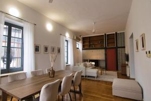 a living room with a wooden table and chairs at Phaedrus Living: Cozy Down Town House Aischylou in Nicosia