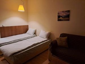 Ένα ή περισσότερα κρεβάτια σε δωμάτιο στο Family Studio, Villa park