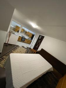 Ένα ή περισσότερα κρεβάτια σε δωμάτιο στο Casa de vacanță M&D
