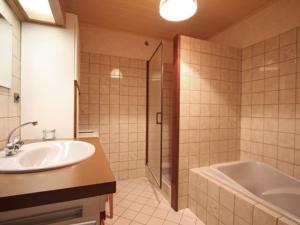 a bathroom with a sink and a tub and a shower at Gîte familial avec salle de jeux, cheminée, terrasse et proche de sites touristiques - FR-1-589-186 in Pierrefitte +26 photos