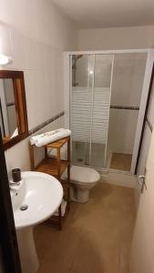 a bathroom with a sink and a toilet and a shower at 972D2 - Gwozey - Bas de villa Tamarin in Rivière-Salée