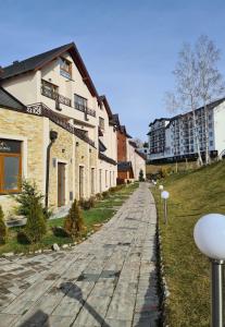 a cobblestone street in front of a building at Mountain Side Kopaonik in Kopaonik +49 photos