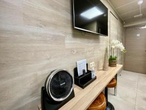TV a/nebo společenská místnost v ubytování Guesthouse ROOM40