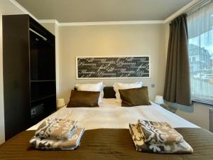 Uma cama ou camas num quarto em City Apartments by Malmedreams