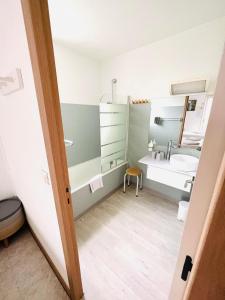 a bathroom with a sink and a mirror at Hôtel Rose des Vents in Baix +69 photos